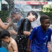 Children playing in fire hydrant water